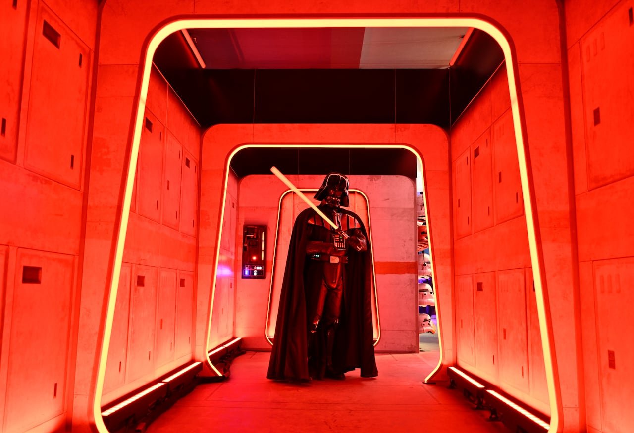 default-544 person in star wars darth vader costume stands surrounded by red lights